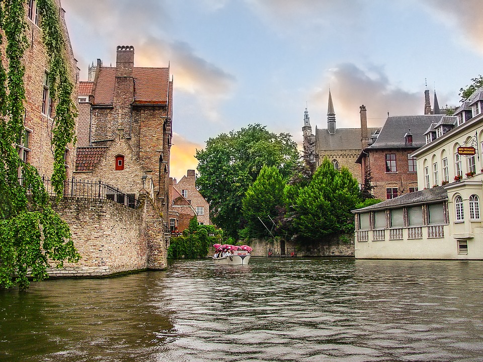 bruges brugges belgium canal tree rain city old europe travel water boat spires ivy bruges bruges belgium belgium belgium belgium belgium